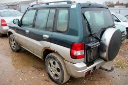 Zamek drzwi tył lewy Mitsubishi Pajero Pinin 2003