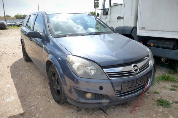 Błotnik przód lewy Opel Astra H 2010 Kombi (kod lakieru: GBI)