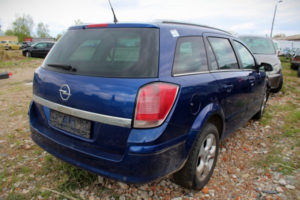 Zamek drzwi tył prawy Opel Astra H 2005 Kombi 