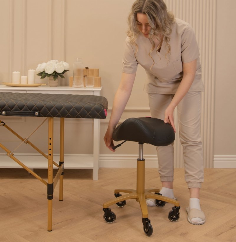 Krzesło kosmetyczne taboret typu siodło RODEO CZARNY - ZŁOTY I-COUCOU