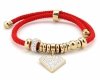 GOLDENES ARMBAND MIT EDELSTAHL