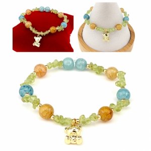 1862i Bransoletka akwamaryn oliwin kamień na gumce jubilerskiej miś