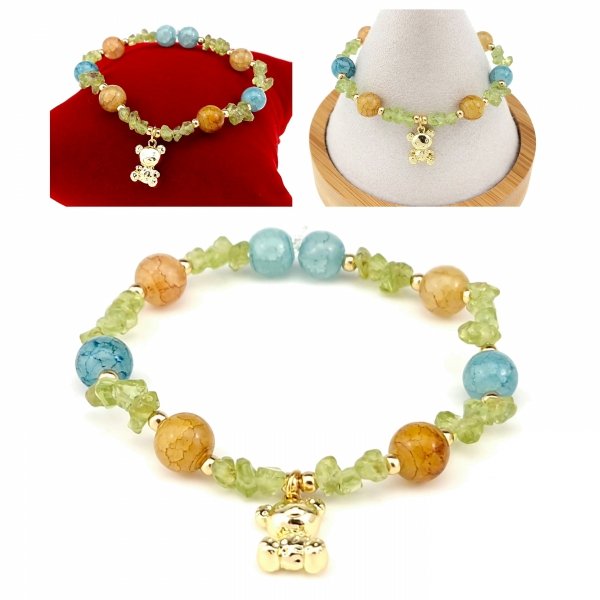 1862i Bransoletka akwamaryn oliwin kamień na gumce jubilerskiej miś