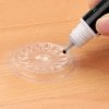 Plastikowa podkładka na kroplę kleju Glue Holder 5szt  (rabat -30%)