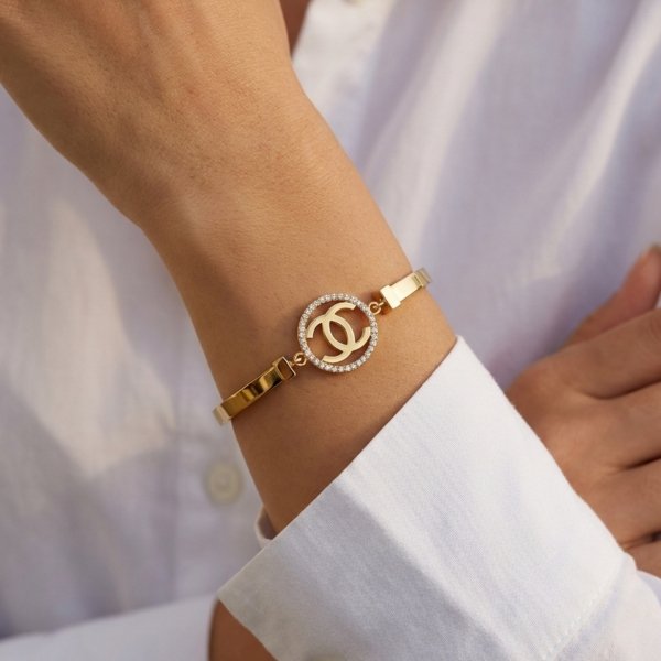 Bransoletka półsztywna koło litery złoto 585 