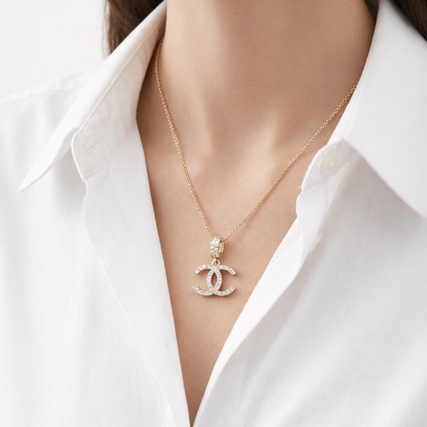 Wisior splecione litery złoto 585