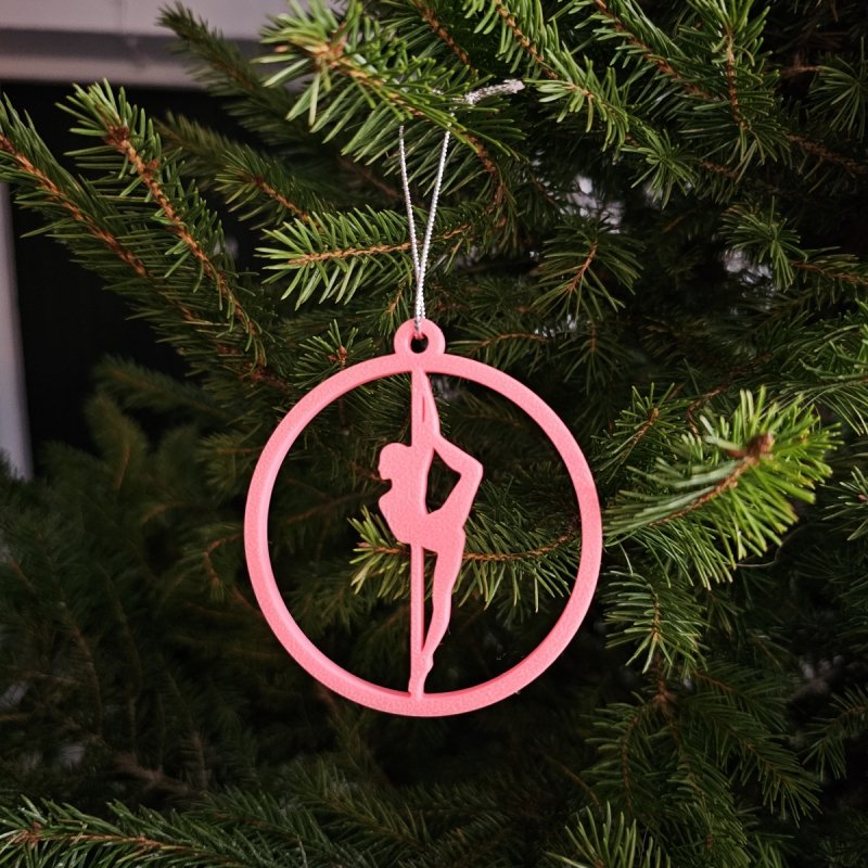 Pink Glow in the Dark Pole Dance Ornament (Pose B) on a blue background. Poledance Xmas Gift Idea