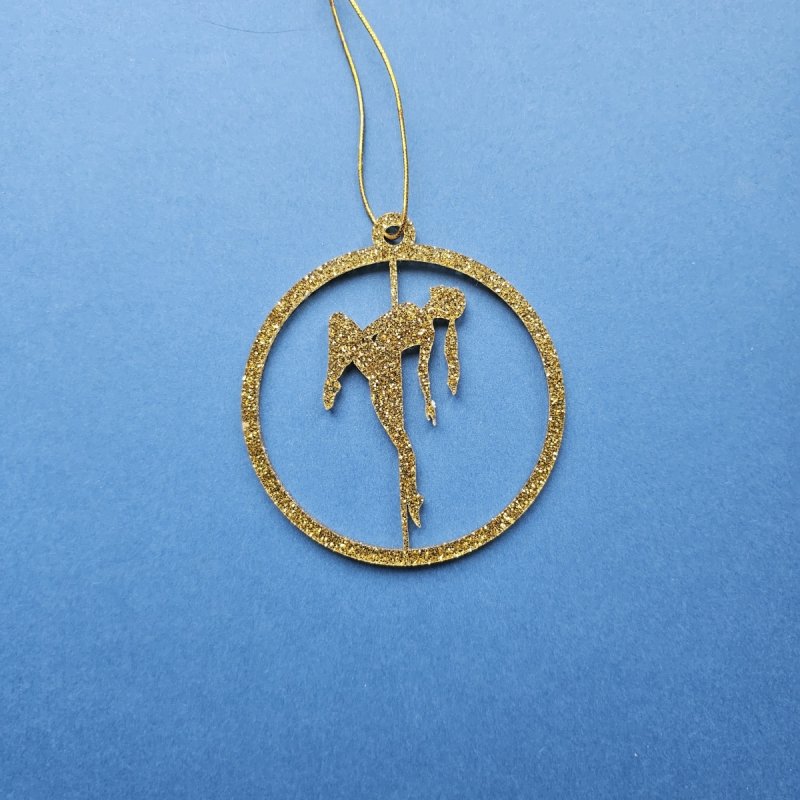 Gold Glitter Pole Dance Ornament Pose 1. Close-up of luxury gold plexi material. Amira Perun