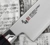 Mcusta Zanmai Revolution Nóż Santoku 15cm