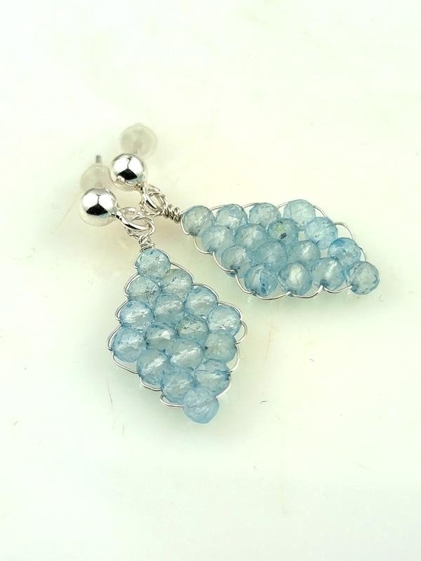 Kolczyki ze srebra Ag999 z kulkami błękitnego topazu dla artysty, autora